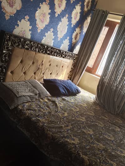 wooden bed with matress