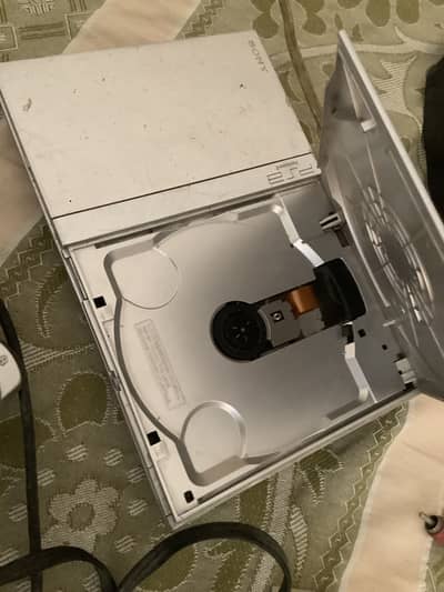 Playstation 2 console and wired controllers and  8mb memory card