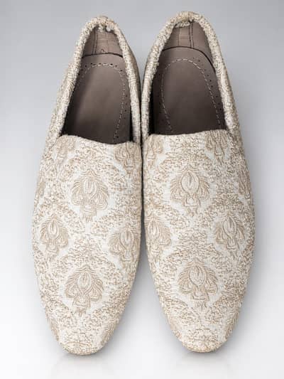 Embroidered groom loafers.
