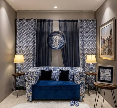 sofa set with cushions, curtains and lamps