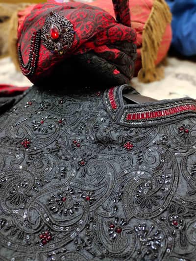 Black embellished sherwani with kulla and embroided khussa