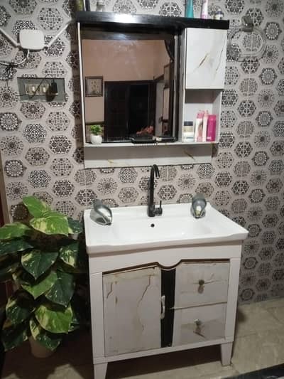 white and black color vanity with cabnet and draws with mirror  rack