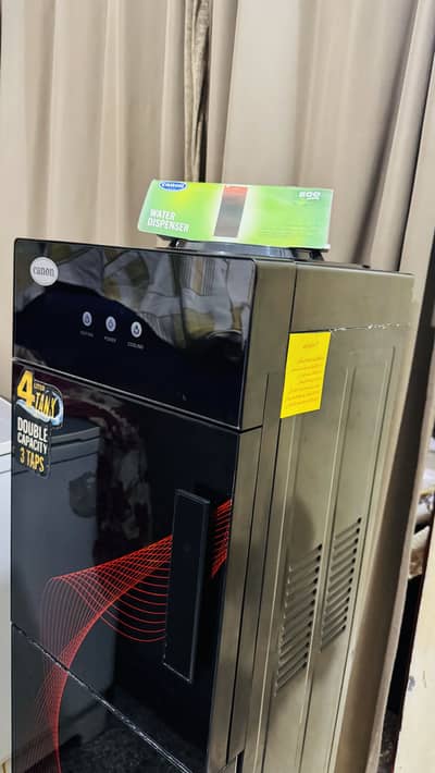 Canon  water dispenser just like new with chọki ănd water bottle