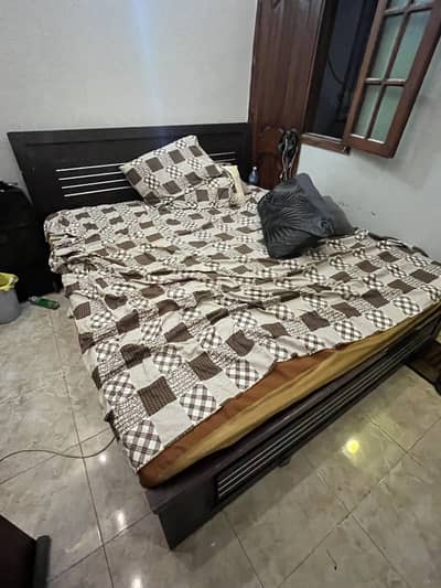Bed with spring mattress and waterproof cover