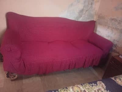 well maintained and comfortable sofa set with covers. . .