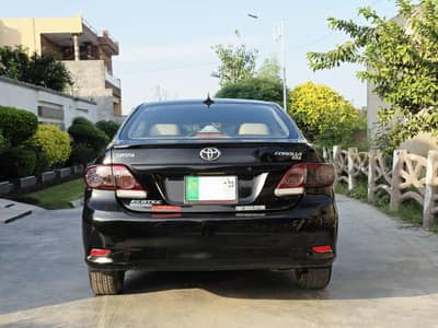 Toyota Corolla XLI 2011 black lahore registered chat piller digi bonet
