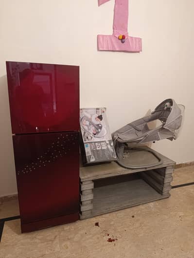 Three things include pel fridge , Electric baby cot + Full size table,
