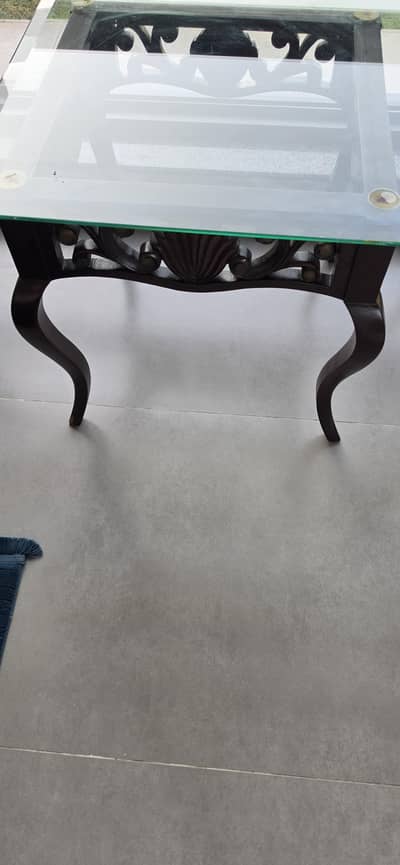 Beautiful carved wooden tables with glass top