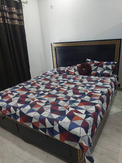 Double bed with mattress and side table available for sale