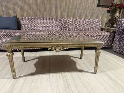 Wooden center table with two side tables and glass tops