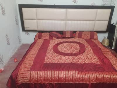 double bed without mattress. and side tables.  8 feet and good condit