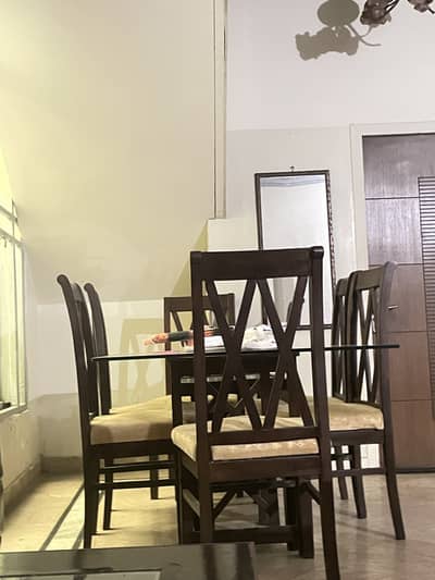 Glass top Dining Table with six beautiful design chairs urgent sale