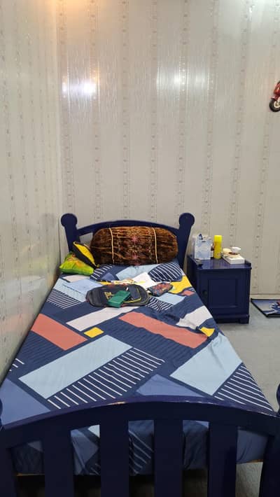 two single beds with side tables