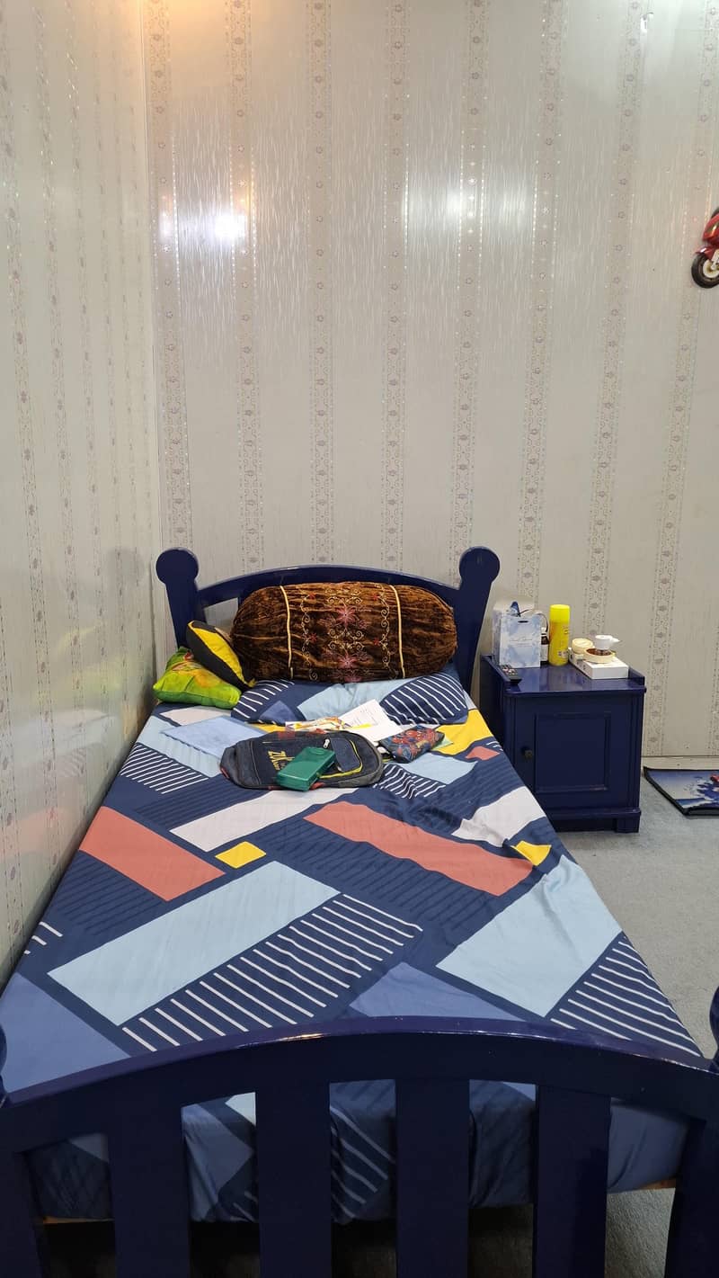 two single beds with side tables 0