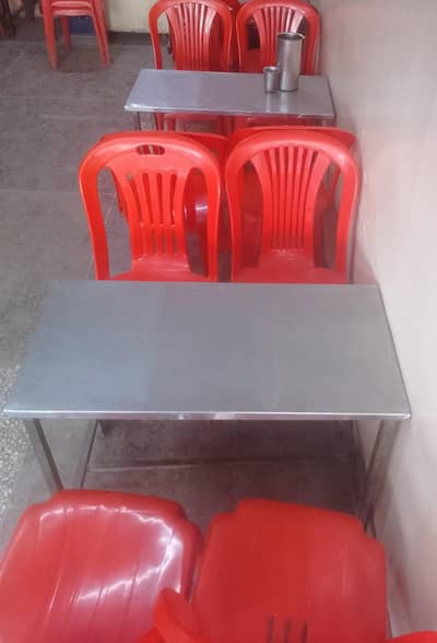 restaurant plastic chairs and steel tables