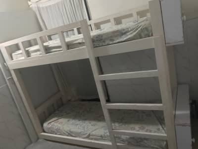 white wooden customize bed with cabinets