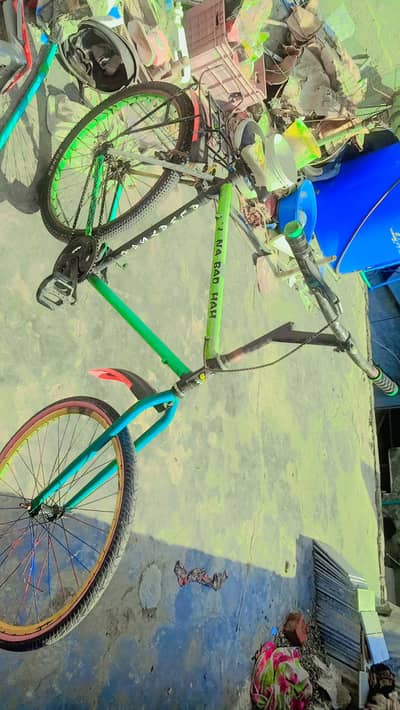 bicycle in good condition/green and yellow colour