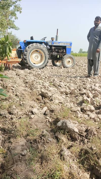 a tractor in the mean of tractor. . . . a massive equipment for agri