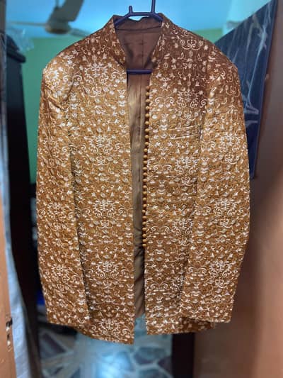 new branded Masterjee stitched prince coat golden colour fancy. .
