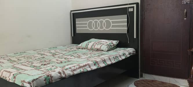 bed with sofa and table