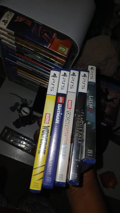 wolverine batman lego marvel tokon and lies of p  ps5 playstation game