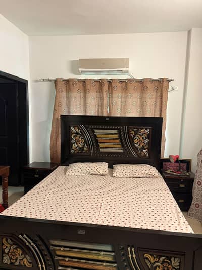 Bed with side tables and dressing table