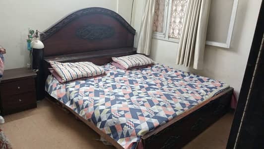 Bed with side table