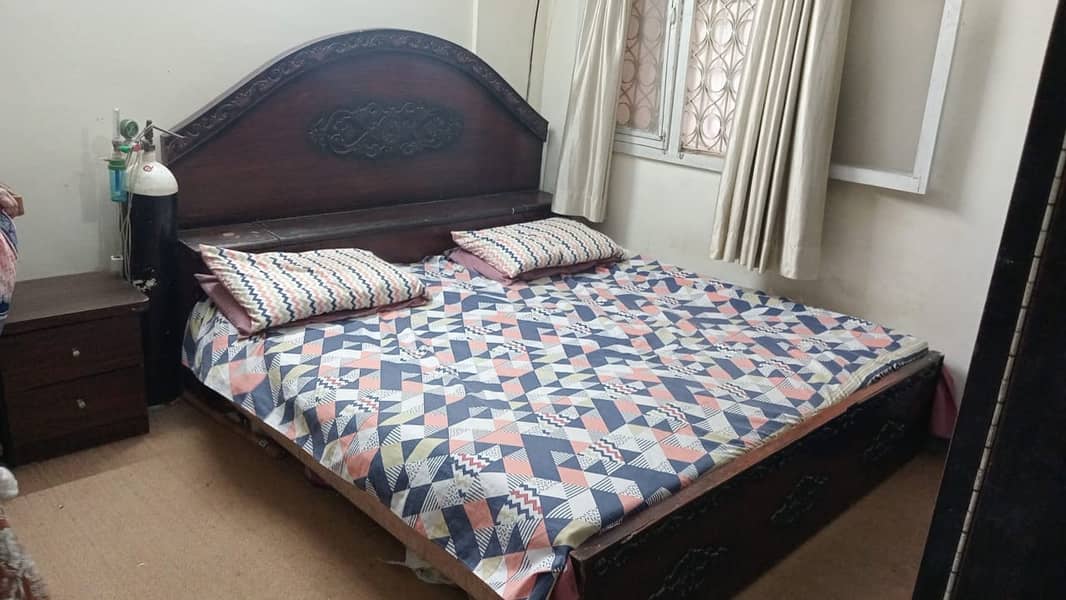 Bed with side table 0