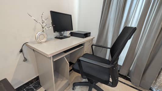 office table and chair with computer and moniter