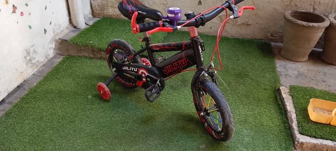 Kids Cycle with red and black colour.