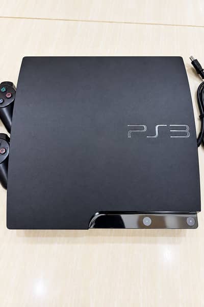 Play station 3 slim ( jail break ) with 2 New Controller’s with games