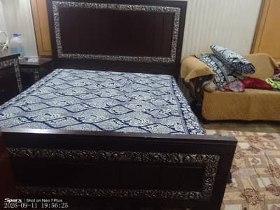 Double bed with side and dressing table and showcase