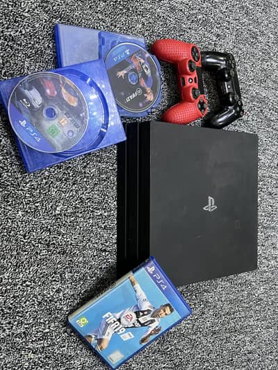 PS4 PRO 1TB WITH 2 CONTROLLERS AND GAMES