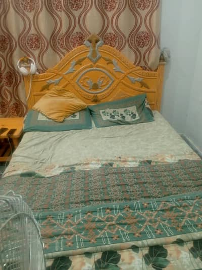 Bed with side table