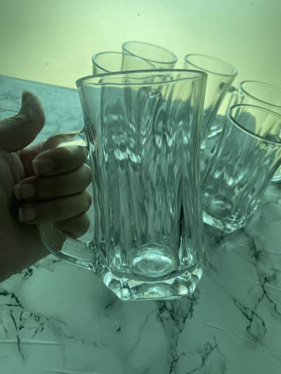 Large mugs and cooking and serving spoons