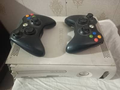 Xbox 360 with 2 wireless controller and 30 plus games installed