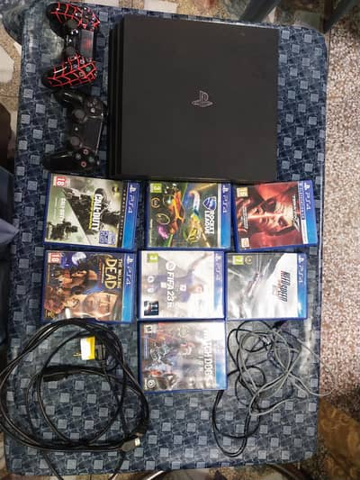 PS 4 pro 1tb with 2 controller and 7 gaming CDs with cables