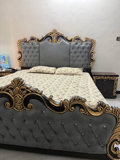 king size bed with 2 side tables and dressing