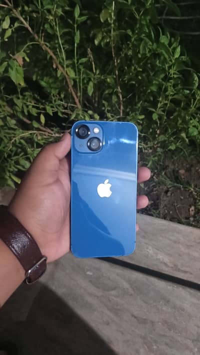 Apple iPhone 13 with black dot on screen battery health is 79