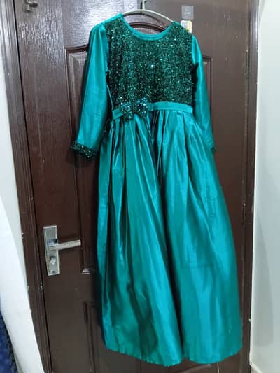This is a silk green frock. Used but in new condition.