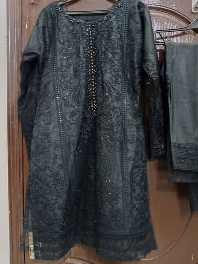 Black colored kurti and shalwar.