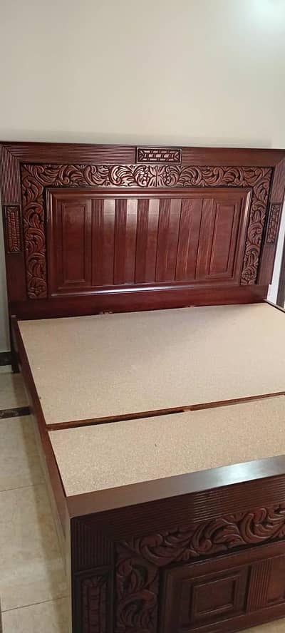 double bed with side tables and dressing table