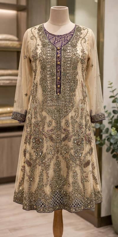 Skin heavy embroidered net frock with purple  jamawar trouser