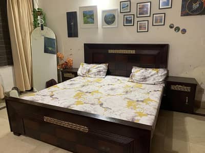 King bed with side tables.