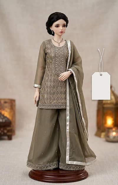 Olive-grey Pakistani formal sharara suit with silver embroidery. ”