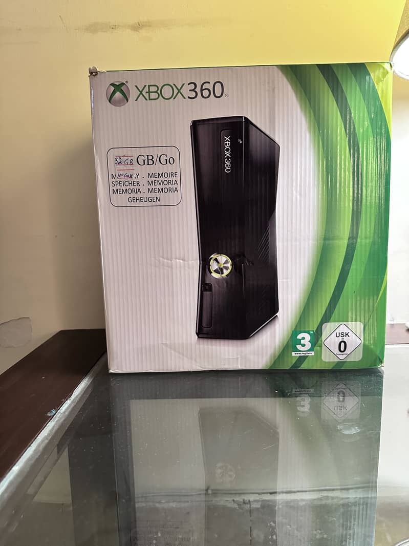 Xbox 360 Slim with multiple accessories 3