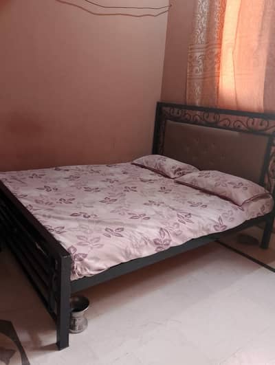 Queen size Iron bed with Mattress  condition 10/9
