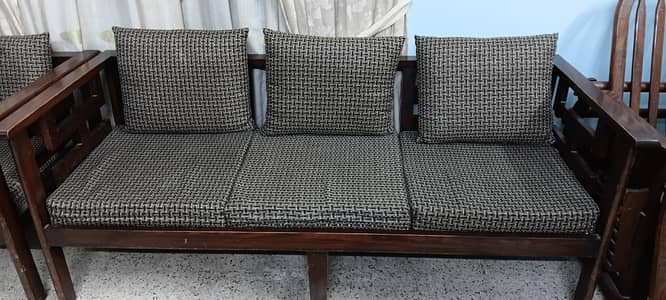 7 seater wooden sofa set. Used but condition is good. 03373195090