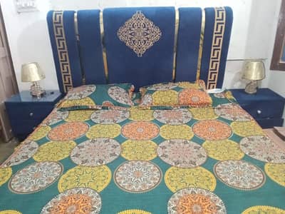 Cushioned bed with side tables, dressing, Coffee table and chairs