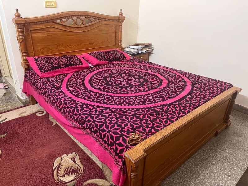 Queen size bed with side table and dressing. 2